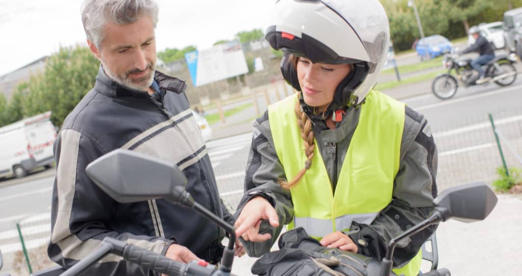 motorcycle rider with safety officer